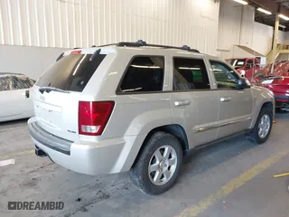 2010 Jeep Grand Cherokee Laredo with VIN 1J4RR4GT9AC106381, listed as a IAAI auction lot 41723268 with 180,008 mi miles. Bid and sale history available at carsss.com. Image 4.