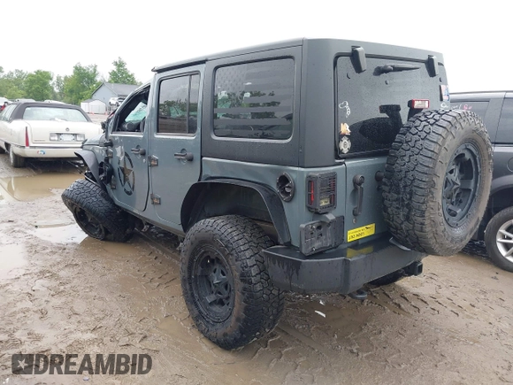 2014 Jeep Wrangler Unlimited Sport with VIN 1C4BJWDG1EL135073, listed as a IAAI auction lot 42435361 with 129,144 mi miles and . Bid and sale history available at DreamBid. Image 3.