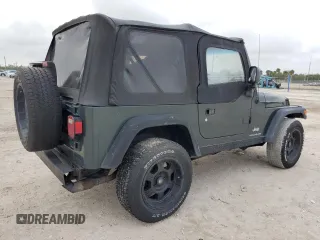2003 Jeep Wrangler SE with VIN 1J4FA29103P313229, listed as a Copart auction lot 79337984 with 135,668 mi miles and Salvage title. Bid and sale history available at DreamBid. Image 3.