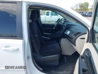 2014 Dodge Grand Caravan American Value with VIN 2C4RDGBG8ER140342, listed as a IAAI auction lot 42198306 with 135,564 mi miles and . Bid and sale history available at DreamBid. Image 5.