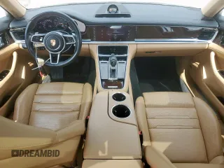 2017 Porsche Panamera с VIN WP0AA2A71HL102183, выставлен на аукционе Copart как лот 57901885 с пробегом 51 605 миль миль и Списание • Salvage title. История ставок и продаж доступна на DreamBid. Изображение 8.