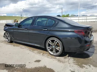 2018 BMW 5 Series M550i xDrive with VIN WBAJB9C55JB049384, listed as a Copart auction lot 54934435 with 79,061 mi miles and Non Repairable. Bid and sale history available at DreamBid. Image 2.