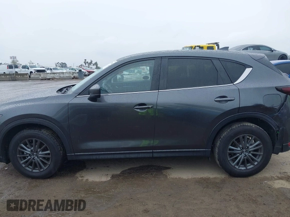 2021 Mazda CX-5 Touring with VIN JM3KFACM6M0480487, listed as a IAAI auction lot 41731646 with 26,951 mi miles and . Bid and sale history available at carsss.com. Image 15.