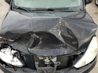 2009 Nissan Versa S z VIN 3N1BC13E19L447131, wystawiony jako Copart lot #54858845 z przebiegiem 190 029 mil mil oraz Nie do naprawy • Non repairable. Historia ofert i sprzedaży dostępna na DreamBid. Obrazek 11.