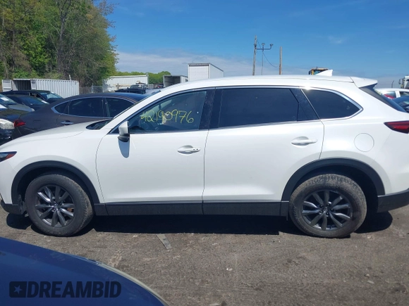 2021 Mazda CX-9 Touring z VIN JM3TCBCYXM0521323, wystawiony jako IAAI lot #42190976 z przebiegiem 56 652 mil mil oraz . Historia ofert i sprzedaży dostępna na DreamBid. Obrazek 14.