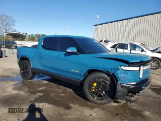 2022 Rivian R1T Launch Edition z VIN 7FCTGAAL7NN000539, wystawiony jako Copart lot #87811245 z przebiegiem Nie podano mil oraz Szkody całkowita. Historia ofert i sprzedaży dostępna na DreamBid. Obrazek 4.