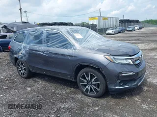 2019 Honda Pilot Touring 7-Passenger with VIN 5FNYF6H61KB067739, listed as a IAAI auction lot 42614123 with 82,244 mi miles and . Bid and sale history available at DreamBid. Image 1.