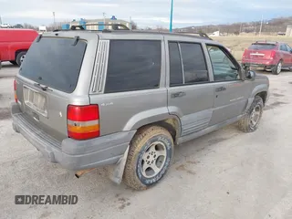 1997 Jeep Grand Cherokee Laredo with VIN 1J4GZ58S4VC745129, listed as a IAAI auction lot 41641005 with 1 mi miles. Bid and sale history available at carsss.com. Image 4.