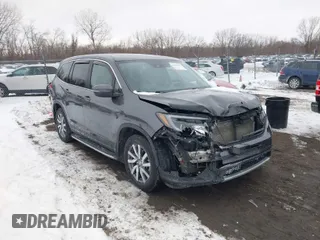 2019 Honda Pilot EX-L with VIN 5FNYF6H58KB010283, listed as a IAAI auction lot 41592114 with 100,745 mi miles. Bid and sale history available at carsss.com. Image 1.