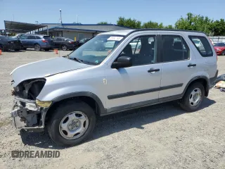 2002 Honda CR-V LX z VIN JHLRD68442C005079, wystawiony jako Copart lot #56992795 z przebiegiem 272 689 mil mil oraz Czysty tytuł • Clean title. Historia ofert i sprzedaży dostępna na DreamBid. Obrazek 1.