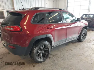 2016 Jeep Cherokee Trailhawk with VIN 1C4PJMBBXGW135138, listed as a IAAI auction lot 41595718 with 267,058 mi miles and . Bid and sale history available at DreamBid. Image 4.