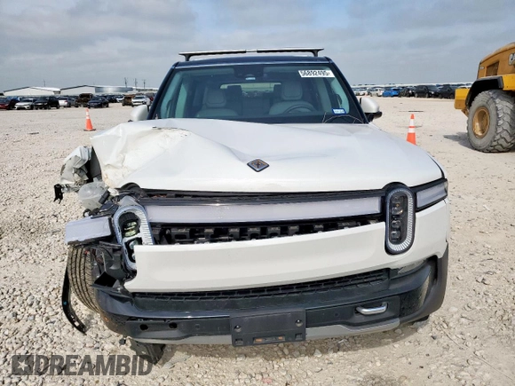 2023 Rivian R1S Adventure z VIN 7PDSGABA4PN026056, wystawiony jako Copart lot #56892495 z przebiegiem Nie podano mil oraz Szkoda całkowita • Salvage title. Historia ofert i sprzedaży dostępna na DreamBid. Obrazek 5.