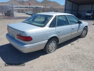 1994 Ford Taurus GL z VIN 1FALP52U2RG186625, wystawiony jako IAAI lot #42381964 z przebiegiem 54 020 mil mil oraz . Historia ofert i sprzedaży dostępna na DreamBid. Obrazek 4.