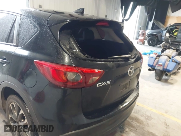2016 Mazda CX-5 Grand Touring with VIN JM3KE2DY9G0705127, listed as a IAAI auction lot 41412910 with 181,993 mi miles. Bid and sale history available at carsss.com. Image 17.