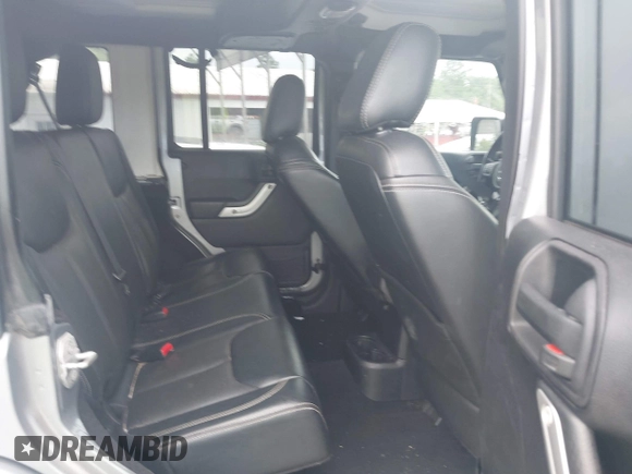 2016 Jeep Wrangler Unlimited Sahara with VIN 1C4BJWEG5GL117872, listed as a IAAI auction lot 42692798 with 119,819 mi miles and . Bid and sale history available at DreamBid. Image 8.