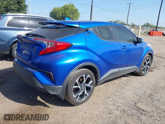 2018 Toyota C-HR XLE z VIN NMTKHMBX7JR004448, wystawiony jako IAAI lot #42785933 z przebiegiem 112 115 mil mil oraz . Historia ofert i sprzedaży dostępna na DreamBid. Obrazek 4.