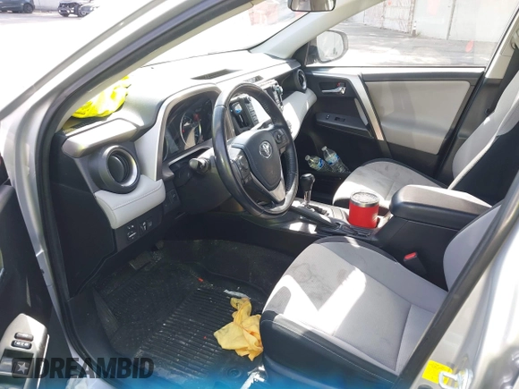 2016 Toyota RAV4 Hybrid XLE with VIN JTMRJREVXGD029019, listed as a IAAI auction lot 42021530 with 74,400 mi miles. Bid and sale history available at carsss.com. Image 18.