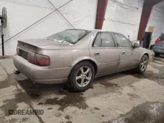 1998 Cadillac Seville STS z VIN 1G6KY5490WU916771, wystawiony jako Copart lot #58699555 z przebiegiem 129 944 mil mil oraz Nie do naprawy. Historia ofert i sprzedaży dostępna na DreamBid. Obrazek 3.
