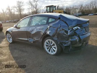 2023 Tesla Model 3 Long Range with VIN 5YJ3E1EBXPF660900, listed as a Copart auction lot 48923265 with 9,954 mi miles and Salvage Title. Bid and sale history available at DreamBid. Image 2.