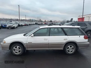 1999 Subaru Legacy Outback z VIN 4S3BG6852X7659898, wystawiony jako IAAI lot #41298823 z przebiegiem 138 834 mil mil oraz . Historia ofert i sprzedaży dostępna na DreamBid. Obrazek 13.