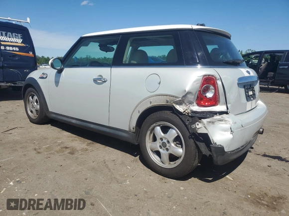 2011 MINI Hardtop with VIN WMWSU3C5XBTX96048, listed as a Copart auction lot 57607955 with 99,632 mi miles and Salvage title. Bid and sale history available at DreamBid. Image 2.