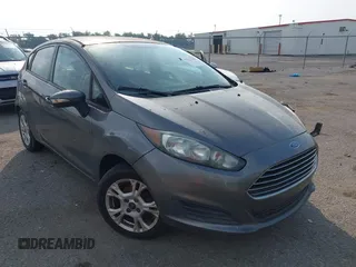 2014 Ford Fiesta SE z VIN 3FADP4EJ8EM215965, wystawiony jako IAAI lot #42317480 z przebiegiem 113 455 mil mil oraz . Historia ofert i sprzedaży dostępna na DreamBid. Obrazek 1.