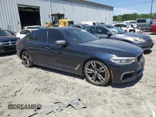2018 BMW 5 Series M550i xDrive with VIN WBAJB9C56JB286479, listed as a Copart auction lot 57108645 with 71,782 mi miles and Salvage title. Bid and sale history available at DreamBid. Image 4.