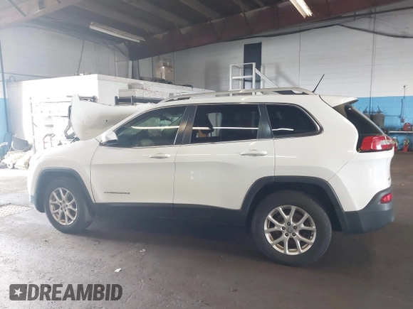 2015 Jeep Cherokee Latitude with VIN 1C4PJMCBXFW784869, listed as a IAAI auction lot 41951297 with 138,396 mi miles. Bid and sale history available at carsss.com. Image 14.