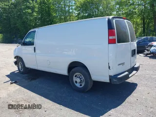 2014 Chevrolet Express Cargo Van with VIN 1GCWGFCA2E1210307, listed as a IAAI auction lot 39559260 with 213,814 mi miles. Bid and sale history available at carsss.com. Image 3.