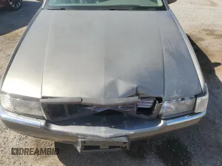 1998 Cadillac Eldorado z VIN 1G6EL12YXWU610918, wystawiony jako Copart lot #57309075 z przebiegiem 168 228 mil mil oraz Szkoda całkowita • Salvage title. Historia ofert i sprzedaży dostępna na DreamBid. Obrazek 11.