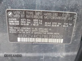 2011 BMW X5 35i with VIN 5UXZV4C57BL739907, listed as a IAAI auction lot 42135572 with 0 mi miles. Bid and sale history available at carsss.com. Image 9.