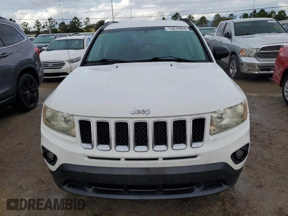 2011 Jeep Compass with VIN 1J4NT1FB8BD138161, listed as a Copart auction lot 73679894 with 199,735 mi miles and Salvage Title. Bid and sale history available at carsss.com. Image 5.