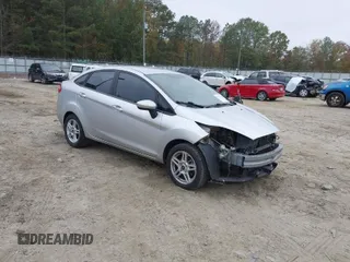2017 Ford Fiesta SE z VIN 3FADP4BJ3HM170751, wystawiony jako IAAI lot #40757768 z przebiegiem 127 946 mil mil oraz . Historia ofert i sprzedaży dostępna na DreamBid. Obrazek 1.