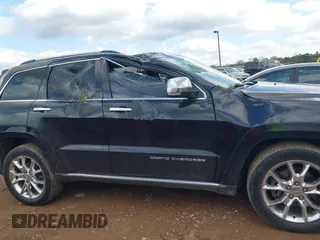2015 Jeep Grand Cherokee Summit with VIN 1C4RJFJT1FC768707, listed as a IAAI auction lot 41863454 with 122,564 mi miles. Bid and sale history available at carsss.com. Image 13.