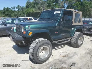 1999 Jeep Wrangler Sahara with VIN 1J4FY49S6XP478675, listed as a Copart auction lot 52147605 with 157,971 mi miles and Salvage Title. Bid and sale history available at carsss.com. Image 1.