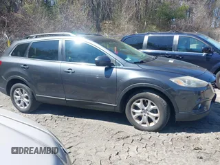 2015 Mazda CX-9 Touring with VIN JM3TB3CV1F0461854, listed as a IAAI auction lot 42068299 with 128,124 mi miles. Bid and sale history available at carsss.com. Image 13.