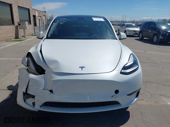 2023 Tesla Model Y Long Range with VIN 7SAYGDEE2PF696336, listed as a IAAI auction lot 41894686 with 34,203 mi miles. Bid and sale history available at carsss.com. Image 12.