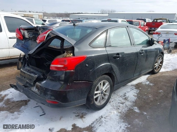 2016 Ford Focus SE with VIN 1FADP3F21GL235559, listed as a IAAI auction lot 41624268 with 136,330 mi miles. Bid and sale history available at carsss.com. Image 4.