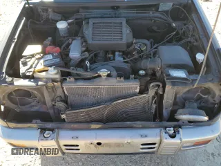 1996 Mitsubishi Montero z VIN H56A0209464, wystawiony jako Copart lot #76590414 z przebiegiem 112 578 mil mil oraz Szkoda całkowita • Salvage title. Historia ofert i sprzedaży dostępna na DreamBid. Obrazek 11.