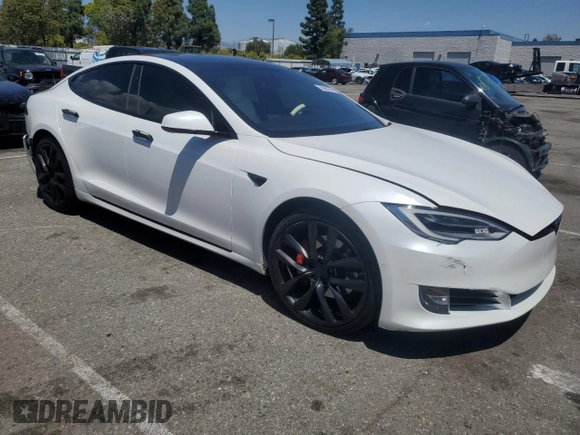 2020 Tesla Model S Performance with VIN 5YJSA1E42LF401157, listed as a Copart auction lot 55082875 with 60,376 mi miles and Salvage title. Bid and sale history available at DreamBid. Image 4.