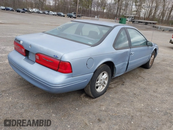 1997 Ford Thunderbird LX z VIN 1FALP62W2VH105702, wystawiony jako IAAI lot #41713980 z przebiegiem 90 775 mil mil oraz . Historia ofert i sprzedaży dostępna na DreamBid. Obrazek 4.