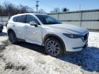 2021 Mazda CX-5 Grand Touring with VIN JM3KFBDM3M1305807, listed as a Copart auction lot 42713655 with 58,162 mi miles and Salvage Title. Bid and sale history available at DreamBid. Image 4.