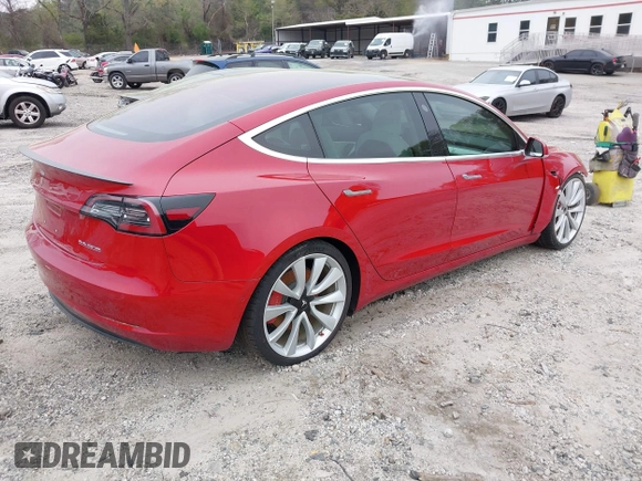 2018 Tesla Model 3 Long Range Battery with VIN 5YJ3E1EB7JF055384, listed as a IAAI auction lot 41924325 with 52,039 mi miles and . Bid and sale history available at DreamBid. Image 4.