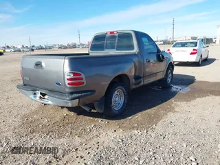 2002 Ford F-150 XL z VIN 1FTRF07272KB83272, wystawiony jako IAAI lot #41266432 z przebiegiem Nie podano mil oraz . Historia ofert i sprzedaży dostępna na DreamBid. Obrazek 4.