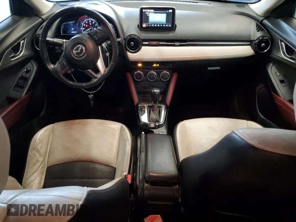 2016 Mazda CX-3 Grand Touring z VIN JM1DKFD74G0137815, wystawiony jako Copart lot #52405765 z przebiegiem 128 922 mil mil oraz Szkoda całkowita • Salvage title. Historia ofert i sprzedaży dostępna na DreamBid. Obrazek 8.
