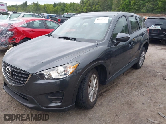 2016 Mazda CX-5 Sport with VIN JM3KE4BY9G0710004, listed as a IAAI auction lot 42323434 with 83,320 mi miles and . Bid and sale history available at DreamBid. Image 17.