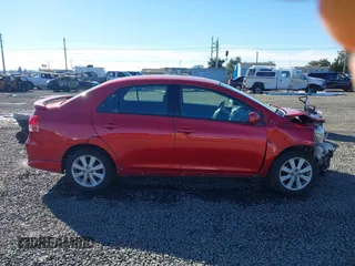 2009 Toyota Yaris z VIN JTDBT903391315199, wystawiony jako IAAI lot #41557557 z przebiegiem 188 971 mil mil oraz . Historia ofert i sprzedaży dostępna na DreamBid. Obrazek 13.