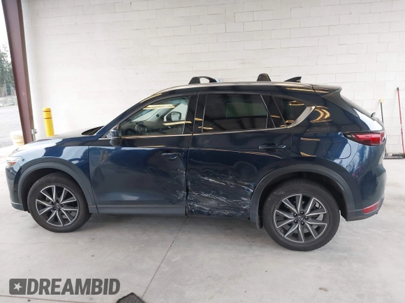 2018 Mazda CX-5 Grand Touring with VIN JM3KFBDM4J0302870, listed as a IAAI auction lot 41934217 with 57,151 mi miles. Bid and sale history available at carsss.com. Image 15.