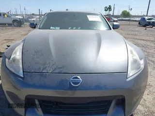 2012 Nissan 370Z z VIN JN1AZ4EH6CM561397, wystawiony jako IAAI lot #41812673 z przebiegiem 53 861 mil mil oraz . Historia ofert i sprzedaży dostępna na DreamBid. Obrazek 13.
