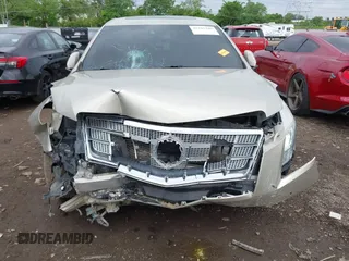2014 Cadillac XTS Platinum z VIN 2G61T5S31E9209179, wystawiony jako IAAI lot #42241440 z przebiegiem 79 651 mil mil oraz . Historia ofert i sprzedaży dostępna na DreamBid. Obrazek 6.